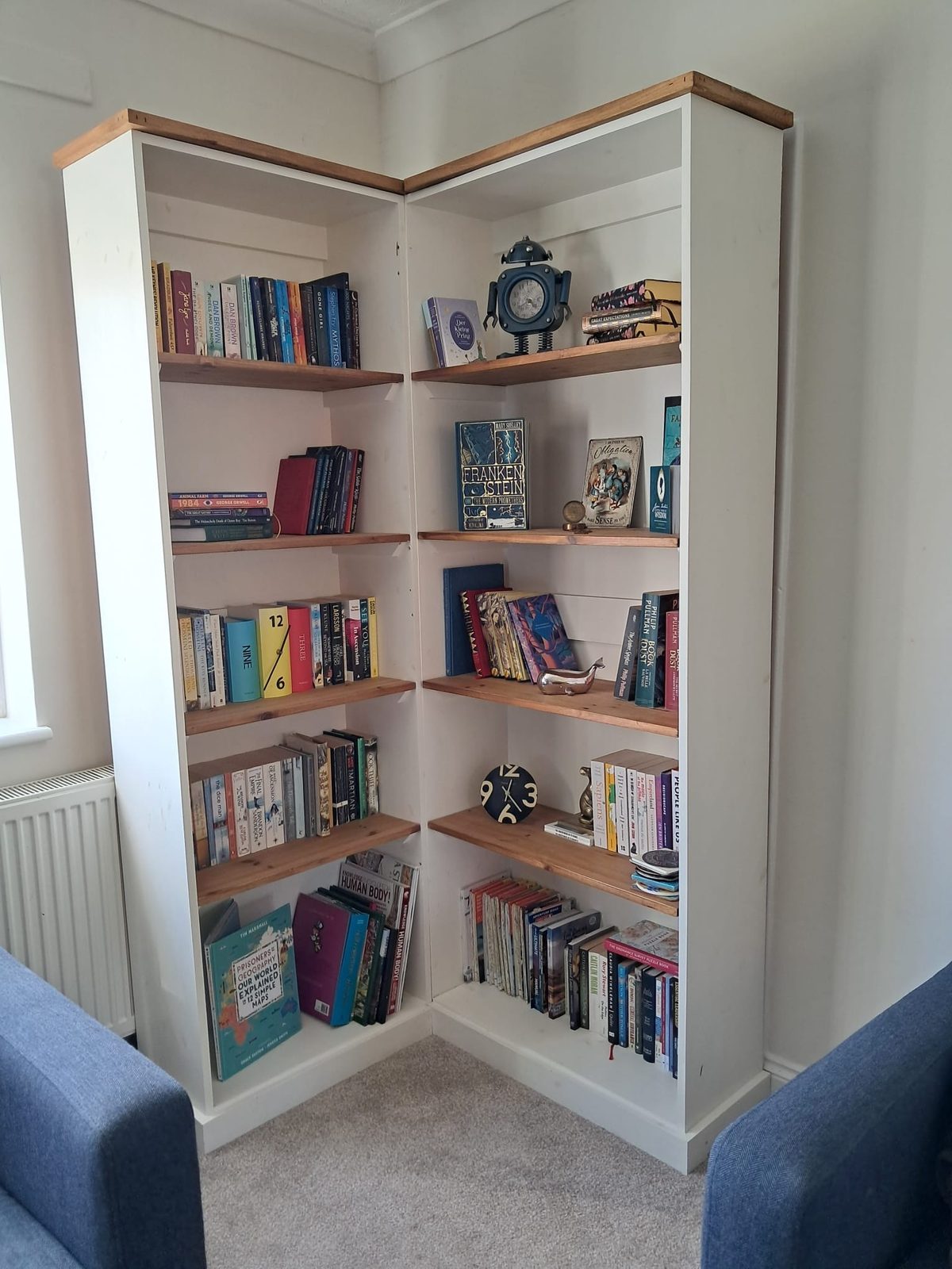 Handmade white corner bookshelf with oak shelves
