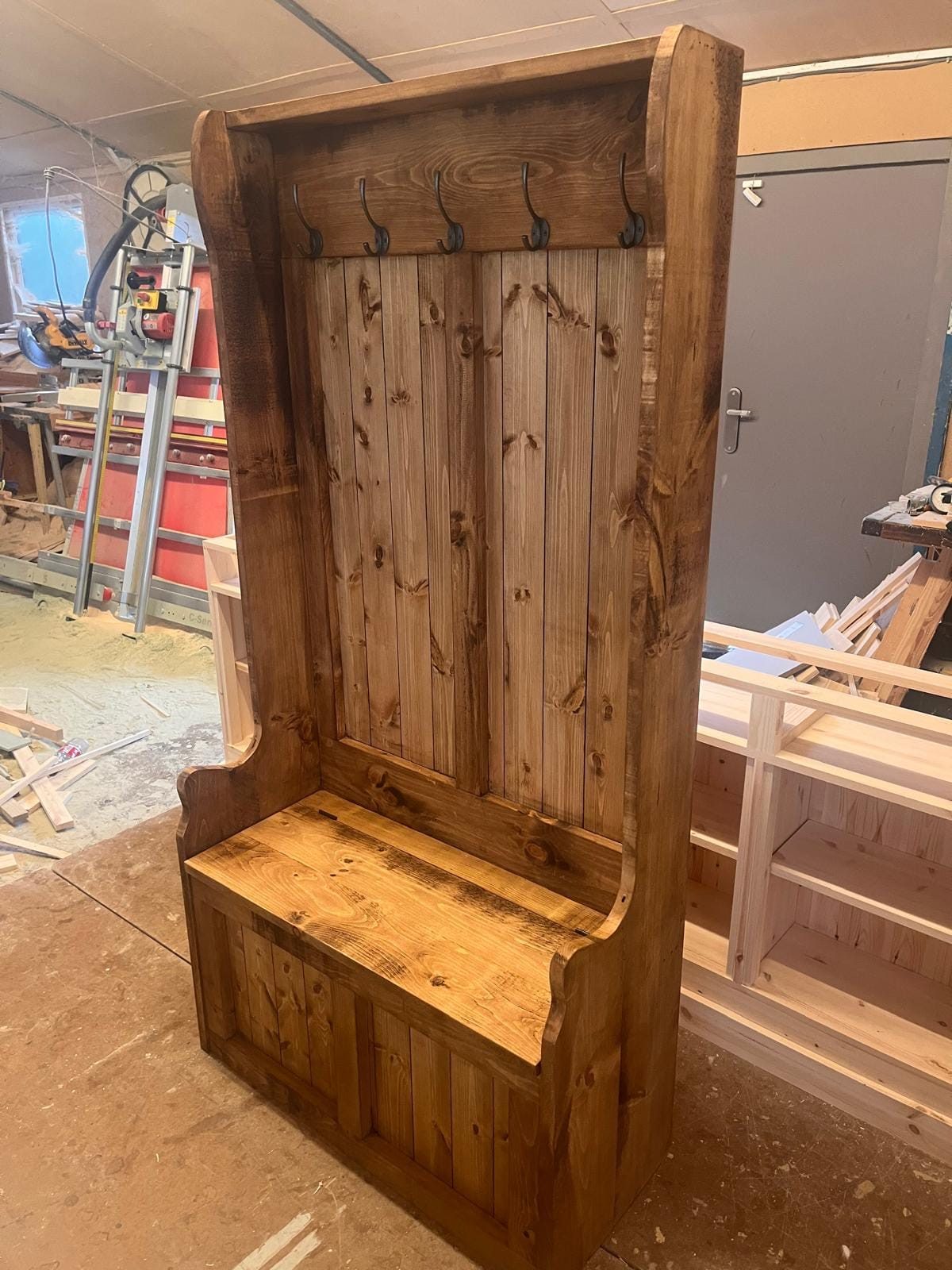 Natural pine hall settle with coat hooks and bench seat